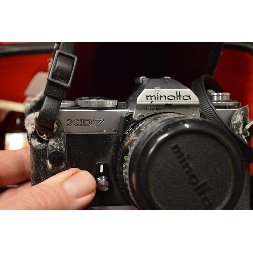 118 - Quantity of assorted cameras and accessories.