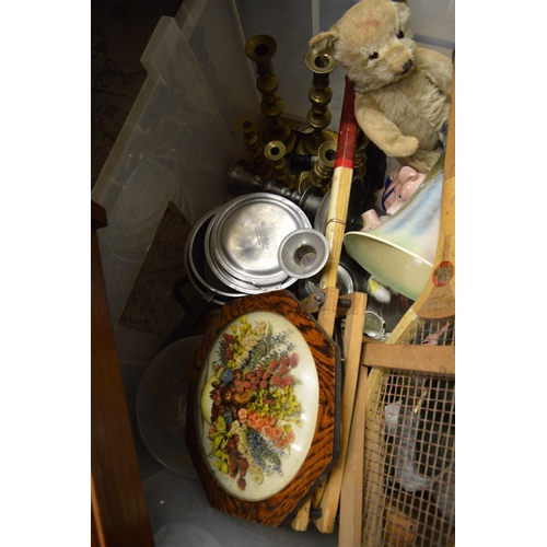126 - A large box of miscellaneous items to include a teddy bear, tennis rackets etc.