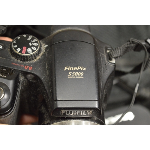 132 - A box of assorted cameras and equipment etc.