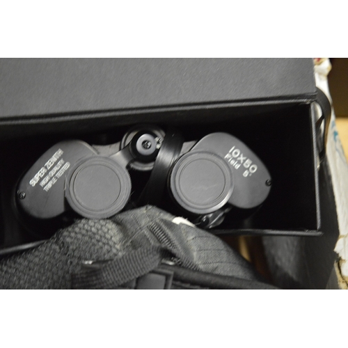 132 - A box of assorted cameras and equipment etc.