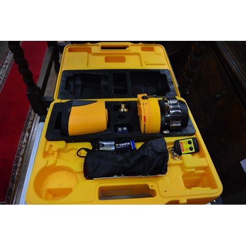 159 - A laser level with tripod stand and a case of related equipment.