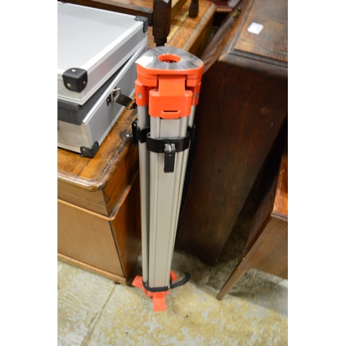 159 - A laser level with tripod stand and a case of related equipment.