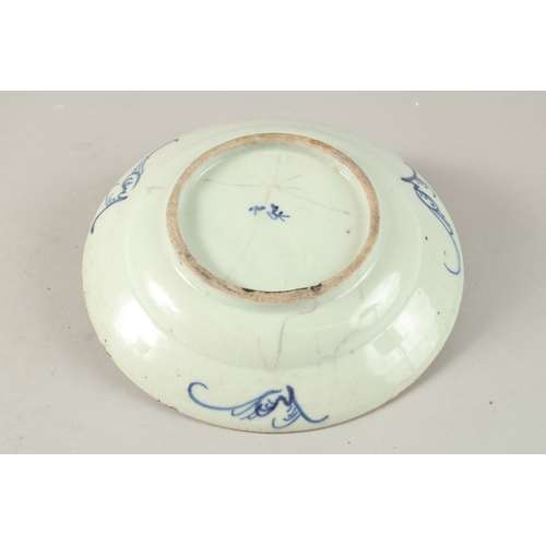 12 - A CHINESE BLUE AND WHITE PORCELAIN DISH, painted with floral motifs, the base with character mark, 1... 