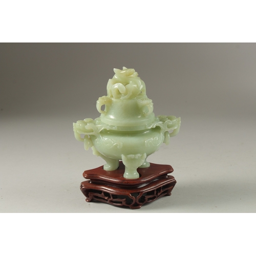 2 - A FINE CARVED JADE LIDDED TWIN HANDLE KORO, on a fitted hardwood stand, with carved dragon and drop-... 