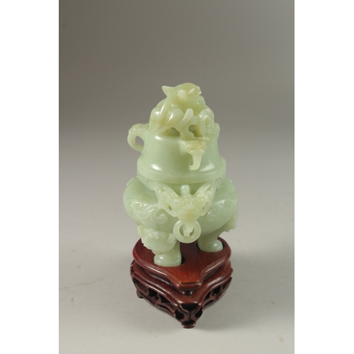 2 - A FINE CARVED JADE LIDDED TWIN HANDLE KORO, on a fitted hardwood stand, with carved dragon and drop-... 