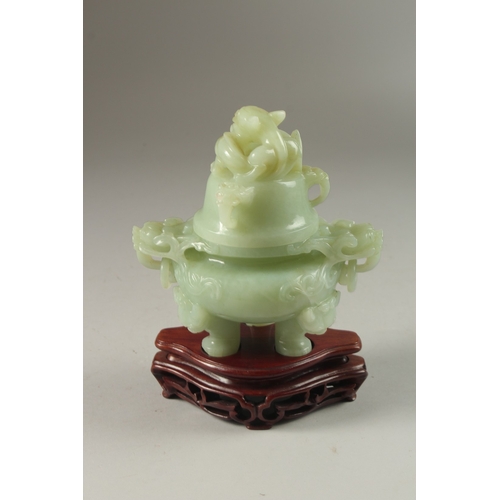 2 - A FINE CARVED JADE LIDDED TWIN HANDLE KORO, on a fitted hardwood stand, with carved dragon and drop-... 