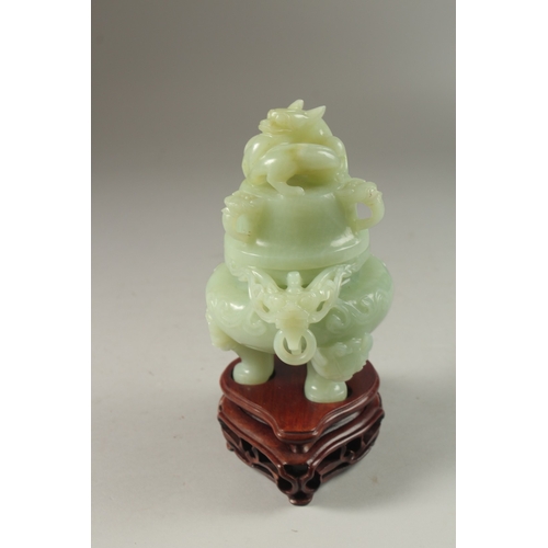 2 - A FINE CARVED JADE LIDDED TWIN HANDLE KORO, on a fitted hardwood stand, with carved dragon and drop-... 