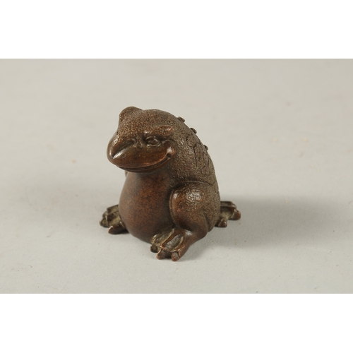 23 - A BRONZE OKIMONO OF A FROG.