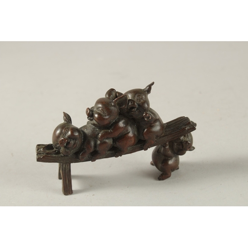 25 - A BRONZE OKIMONO GROUP OF PIGS, 12cm long.