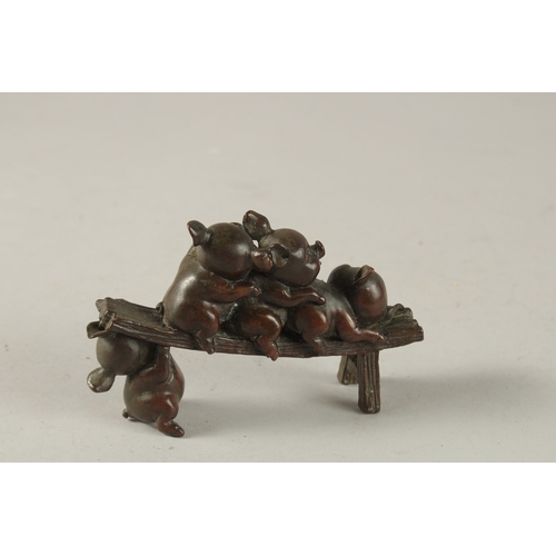 25 - A BRONZE OKIMONO GROUP OF PIGS, 12cm long.