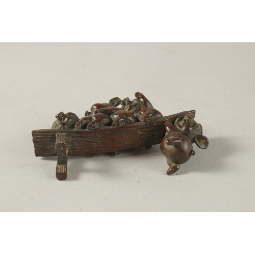 25 - A BRONZE OKIMONO GROUP OF PIGS, 12cm long.