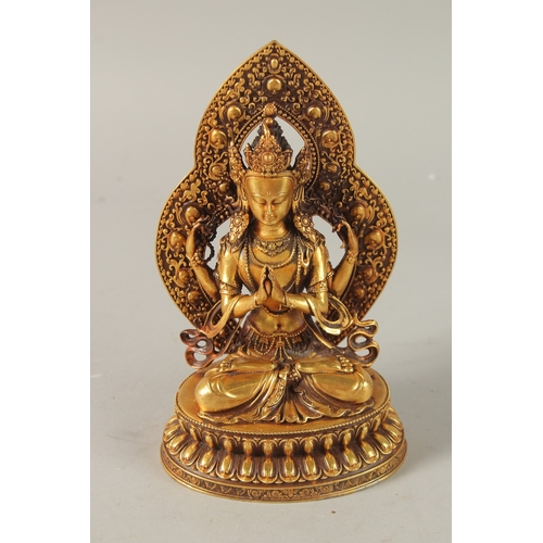 31 - A TIBETAN GILT ALLOY BUDDHA, 17cm high.