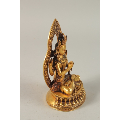 31 - A TIBETAN GILT ALLOY BUDDHA, 17cm high.