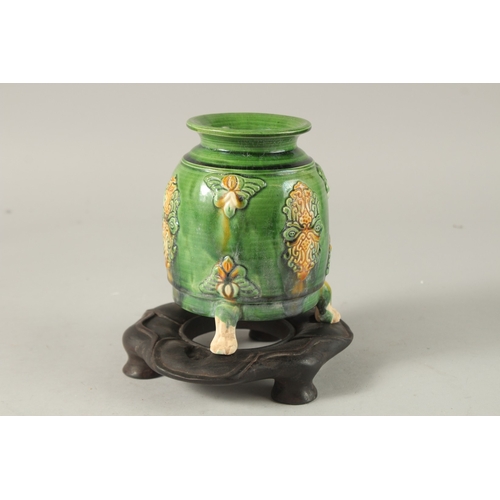 36 - A CHINESE TANG STYLE POTTERY TRIPOD CENSER ON HARDWOOD STAND, censer 13.5cm high.