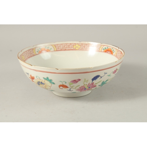 39 - A CHINESE POLYCHROME PORCELAIN BOWL, enamel painted with native flora, 23cm diameter.