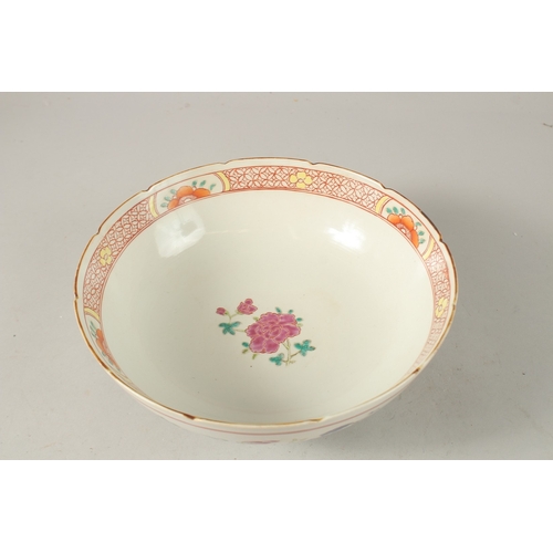 39 - A CHINESE POLYCHROME PORCELAIN BOWL, enamel painted with native flora, 23cm diameter.