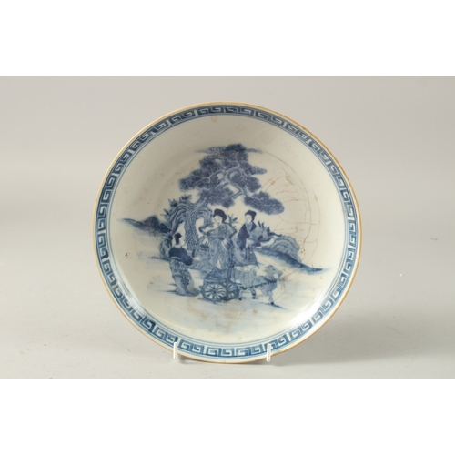 40 - A CHINESE BLUE AND WHITE PORCELAIN PLATE, painted with female figures, the base with character mark,... 