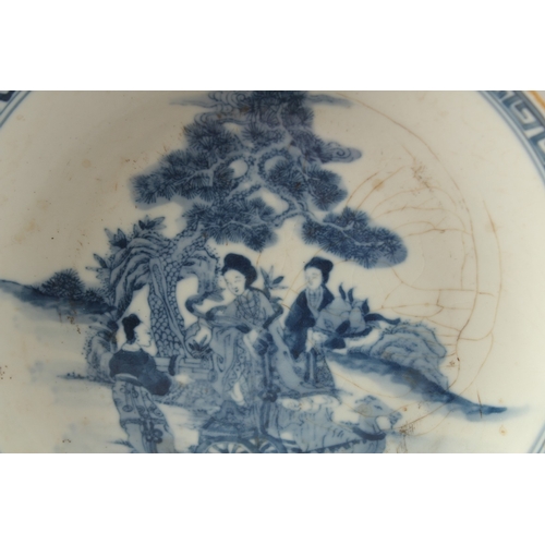 40 - A CHINESE BLUE AND WHITE PORCELAIN PLATE, painted with female figures, the base with character mark,... 