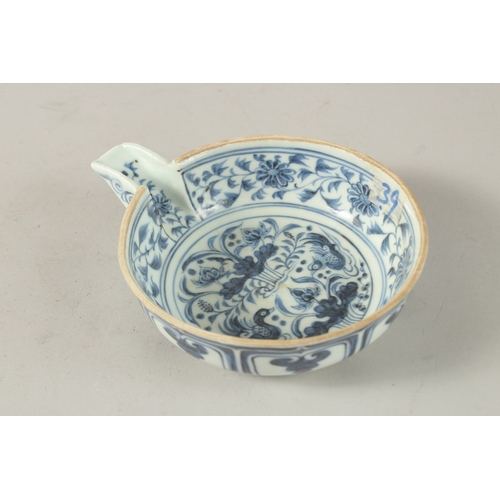 41 - A CHINESE BLUE AND WHITE PORCELAIN OIL POURER, painted with ducks and lotus, bowl 13cm diameter.