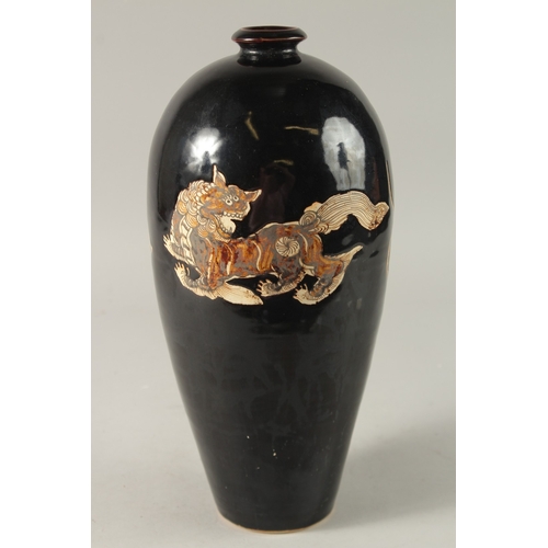 43 - A CHINESE BLACK GROUND CIZHOU VASE, 32cm high.