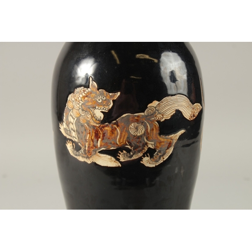 43 - A CHINESE BLACK GROUND CIZHOU VASE, 32cm high.