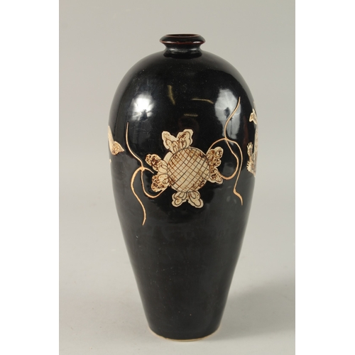 43 - A CHINESE BLACK GROUND CIZHOU VASE, 32cm high.