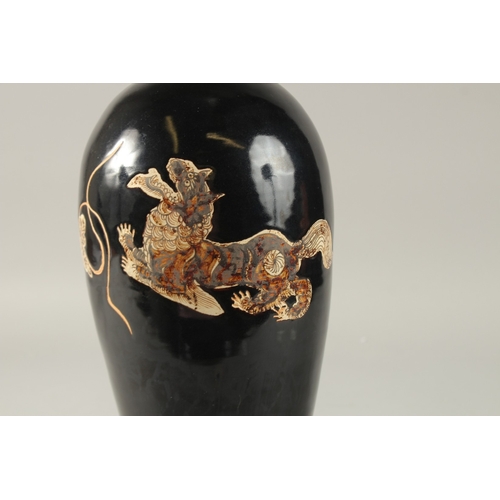 43 - A CHINESE BLACK GROUND CIZHOU VASE, 32cm high.