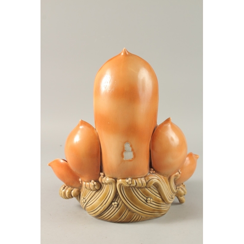 44 - A LARGE CHINESE PART-GLAZED PORCELAIN GUANYIN SITTING ON A LOTUS BASE, 31.5cm high.