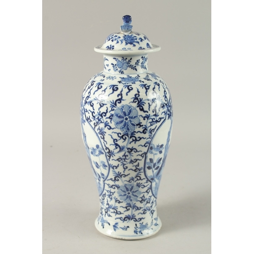 47 - A CHINESE BLUE AND WHITE PORCELAIN LIDDED VASE, finely painted with two mirrored panels of of birds ... 