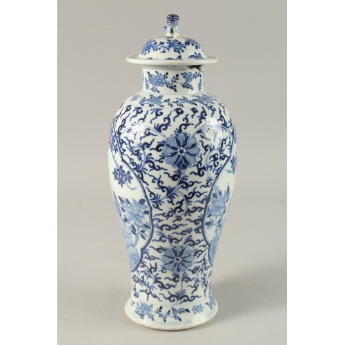 47 - A CHINESE BLUE AND WHITE PORCELAIN LIDDED VASE, finely painted with two mirrored panels of of birds ... 