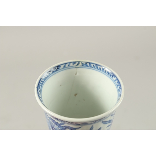 50 - A CHINESE KANGXI PERIOD BLUE AND WHITE PORCELAIN STEM CUP, finely painted with native flora, 15.5cm ... 