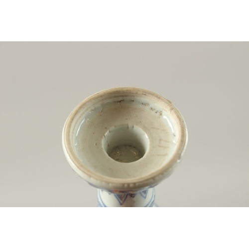 50 - A CHINESE KANGXI PERIOD BLUE AND WHITE PORCELAIN STEM CUP, finely painted with native flora, 15.5cm ... 