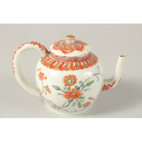 54 - A 17TH CENTURY CHINESE COPPER RED AND WHITE PORCELAIN MINIATURE TEAPOT, painted with flora and gilde... 