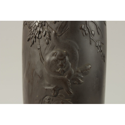 60 - A FINE JAPANESE MEIJI PERIOD BRONZE VASE, relief decorated with monkeys in a tree, signed to the bas... 