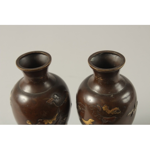 61 - A FINE PAIR OF JAPANESE MEIJI PERIOD MIXED METAL INLAID BRONZE VASES, decorated with gilt and silver... 