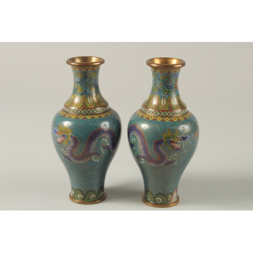 63 - A PAIR OF CHINESE TURQUOISE GROUND CLOISONNE DRAGON VASES, 16.5cm high,