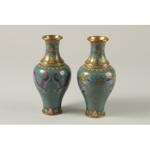 63 - A PAIR OF CHINESE TURQUOISE GROUND CLOISONNE DRAGON VASES, 16.5cm high,