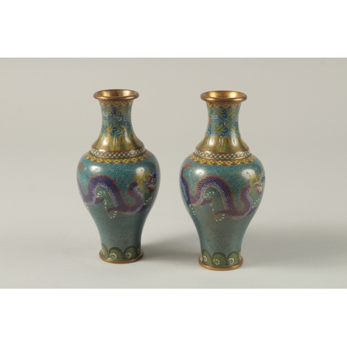 63 - A PAIR OF CHINESE TURQUOISE GROUND CLOISONNE DRAGON VASES, 16.5cm high,