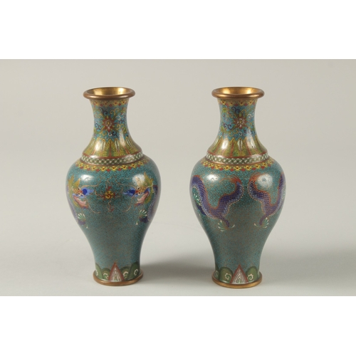 63 - A PAIR OF CHINESE TURQUOISE GROUND CLOISONNE DRAGON VASES, 16.5cm high,