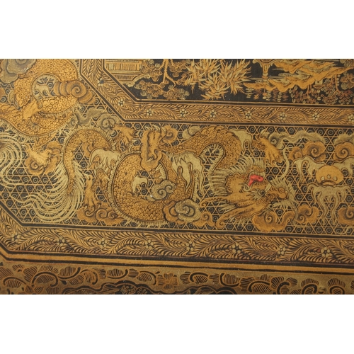 69 - A FINE CHINESE EXPORT GILT AND BLACK LACQUER SEWING BOX, with very finely painted panel of figures i... 