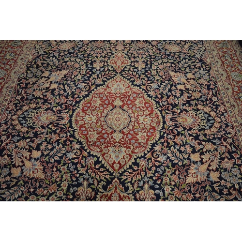 1011 - A GOOD LARGE KIRMAN, 396cm x 300cm.