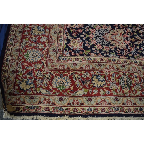 1011 - A GOOD LARGE KIRMAN, 396cm x 300cm.