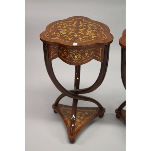 1018 - A PAIR OF LOUIS XVI STYLE SHAPED TOP INLAID TABLES on crossover legs with under-tier. 74cms high x 4... 