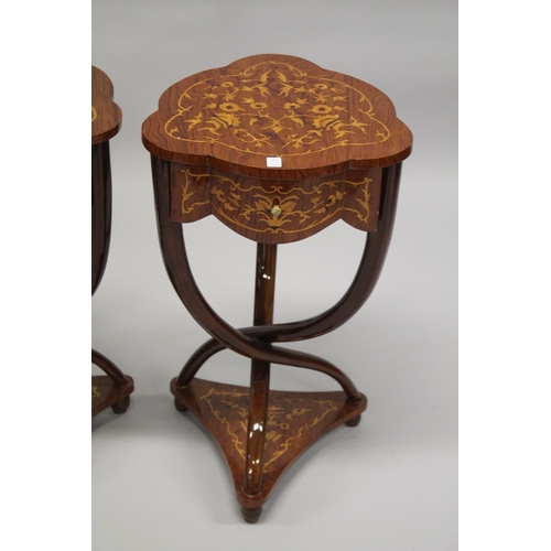 1018 - A PAIR OF LOUIS XVI STYLE SHAPED TOP INLAID TABLES on crossover legs with under-tier. 74cms high x 4... 