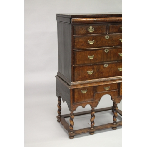 1022 - AN 18TH CENTURY WALNUT CHEST ON STAND, with a cushion moulded drawer, two short over two long drawer... 