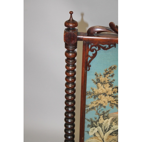 1026 - A GOOD VICTORIAN ROSEWOOD FIRESCREEN with carved cresting, turned side columns, on carved legs, the ... 