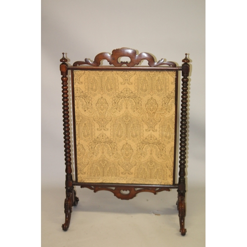 1026 - A GOOD VICTORIAN ROSEWOOD FIRESCREEN with carved cresting, turned side columns, on carved legs, the ... 