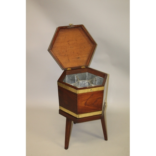 1030 - A GOOD GEORGE III MAHOGANY AND BRASS BOUND HEXAGONAL SHAPED CELLERETTE, the hinged top revealing a c... 