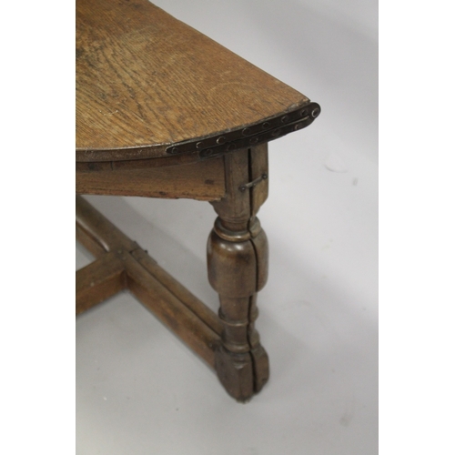 1036 - AN 18TH CENTURY OAK CREDENCE TABLE, with demilune fold-over top, on three baluster turned legs, one ... 