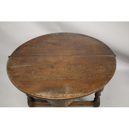 1036 - AN 18TH CENTURY OAK CREDENCE TABLE, with demilune fold-over top, on three baluster turned legs, one ... 